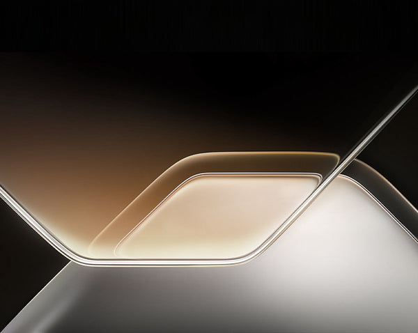 Close-up of a smartphone with a reflective surface on a dark background